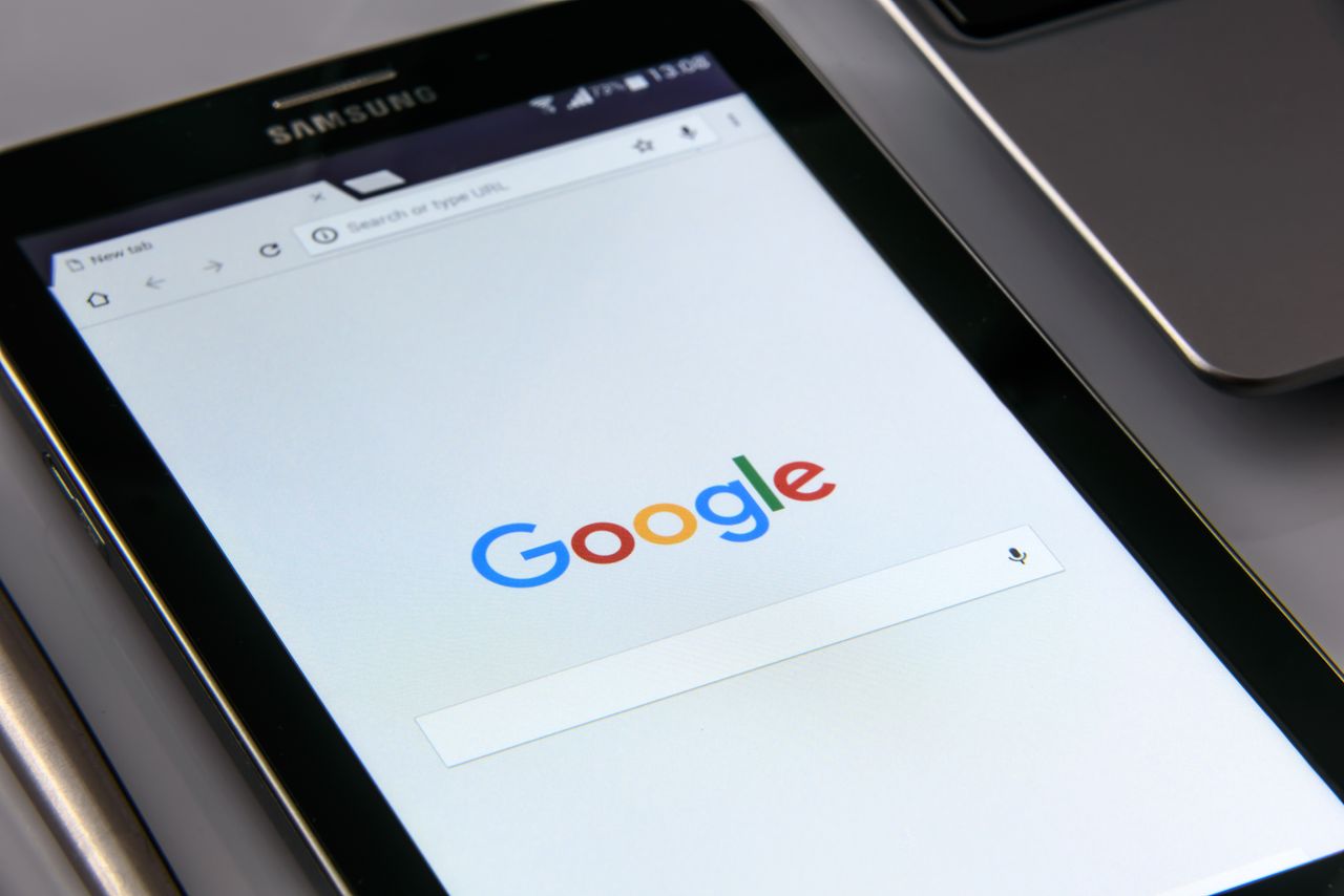 about-02 Close-up view of a tablet showing Google's search page, highlighting technology and web browsing.